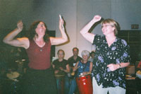 Christina and Toni lead a drum circle at PASIC.